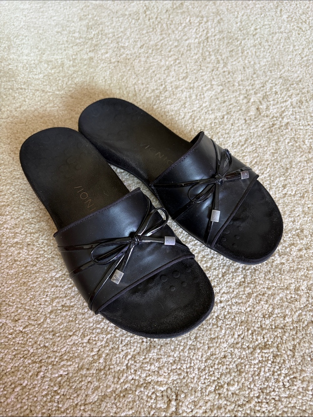 Vionic Black Slide Sandals with Bow and Metallic Accents